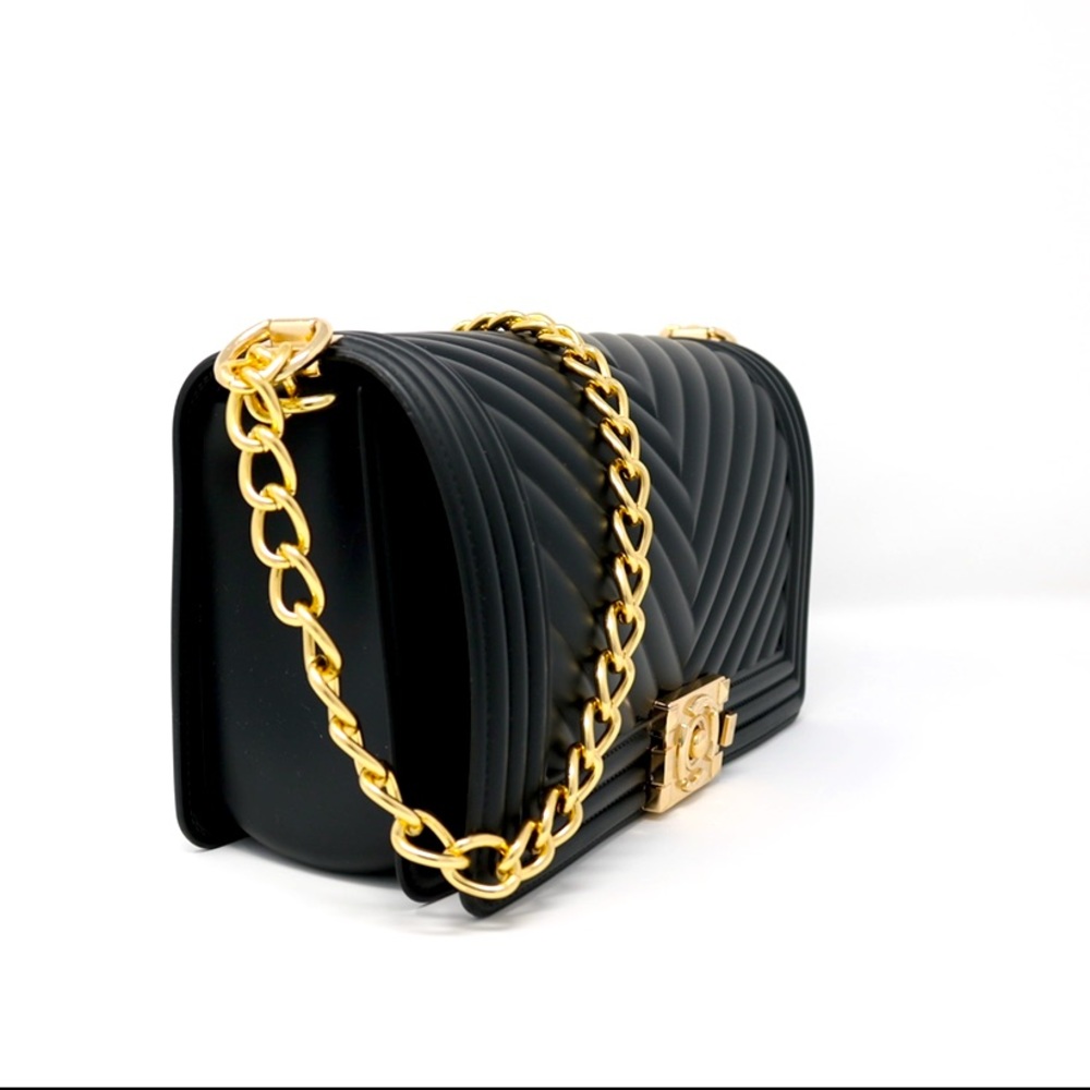 Inspired by luxury brand, boy bag. Excellent quality, durable, & chic.